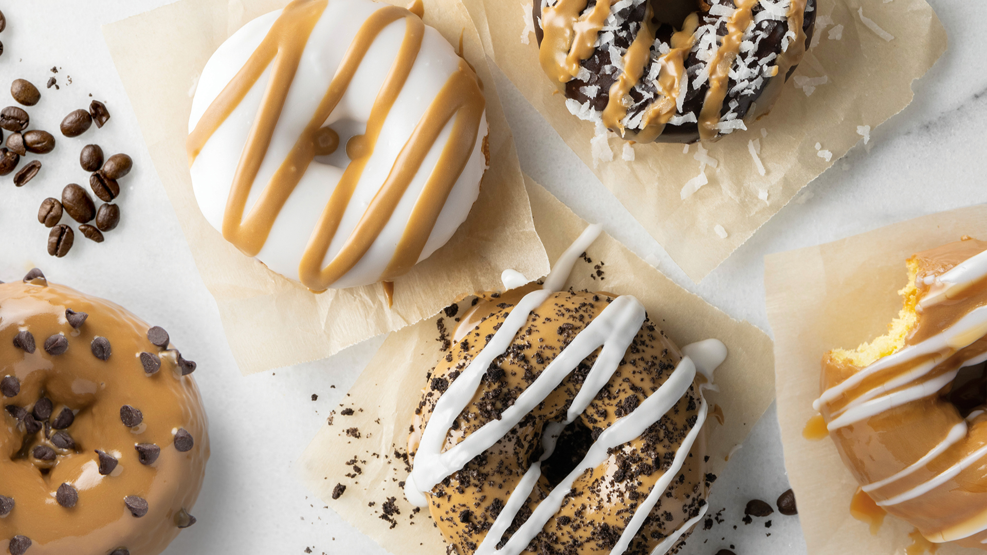 White Iced Long John with Sprinkles Donut  Wedding Cakes Minneapolis  Bakery Farmington Bakery